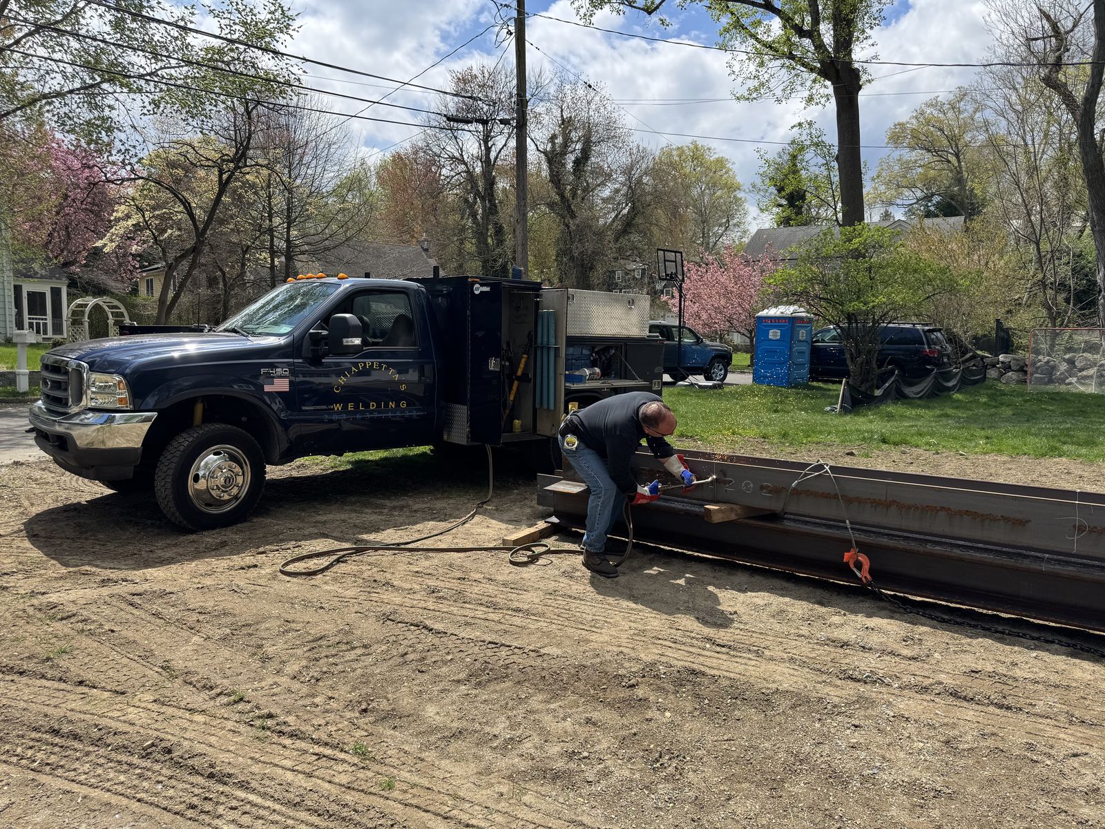 On-site: torch-cutting a beam, right off the truck